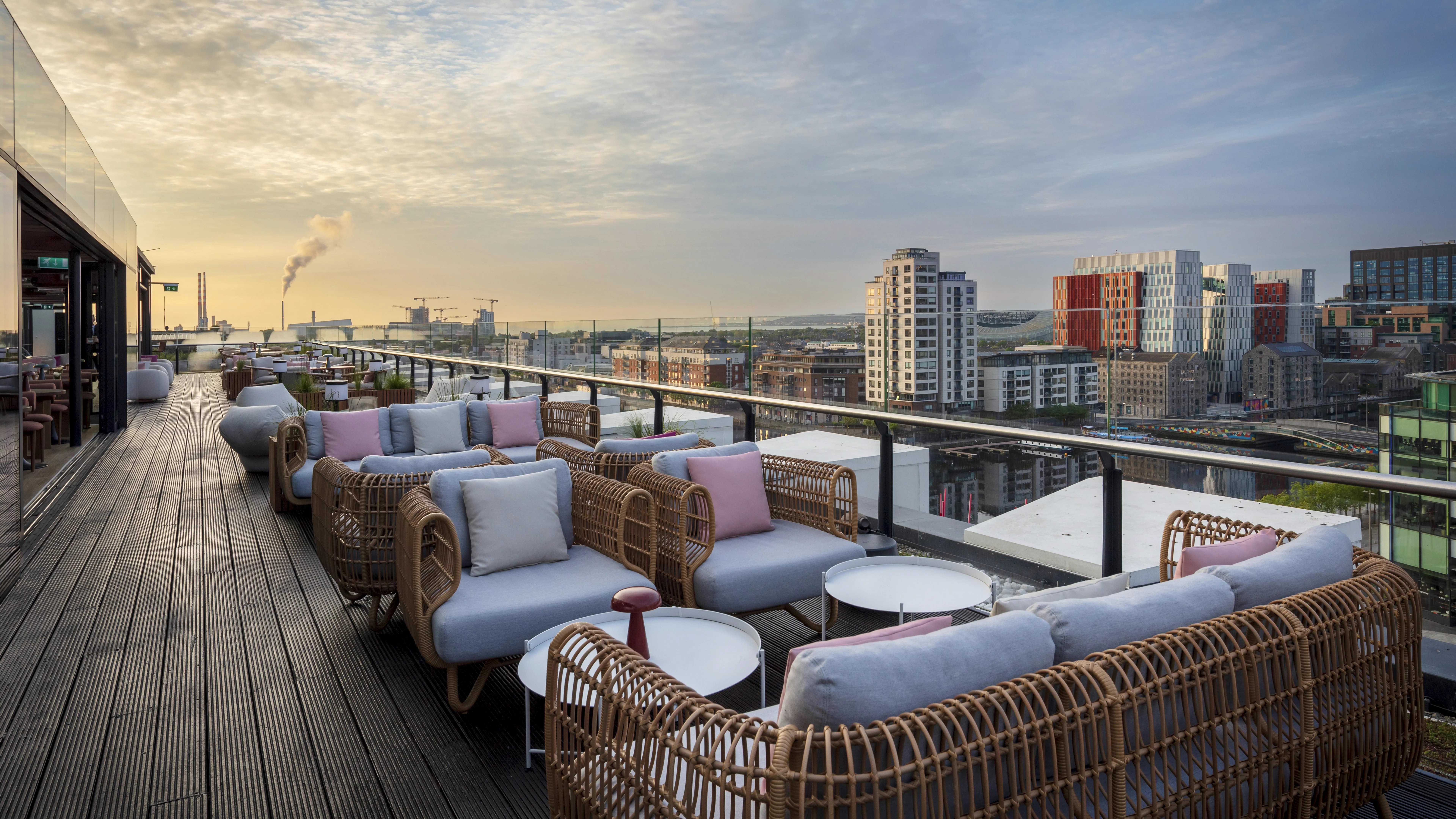 The Marker rooftop bar at blue hour with Dublin city and Liffey below