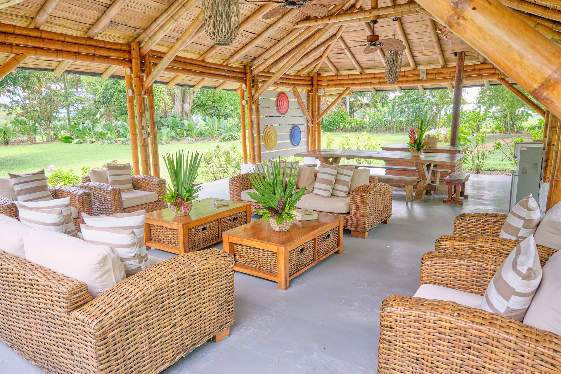 Hacienda Bambusa open-air restaurant with thatched roof and mountain views