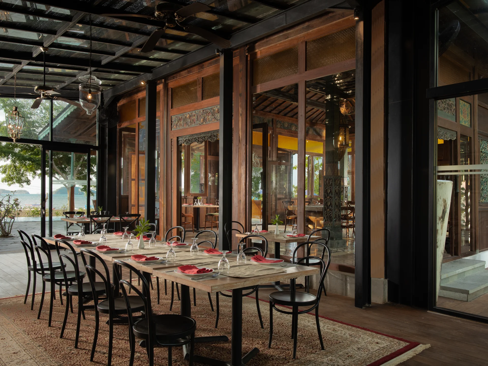 Plataran Komodo open-air restaurant with wooden beams and Flores Sea view