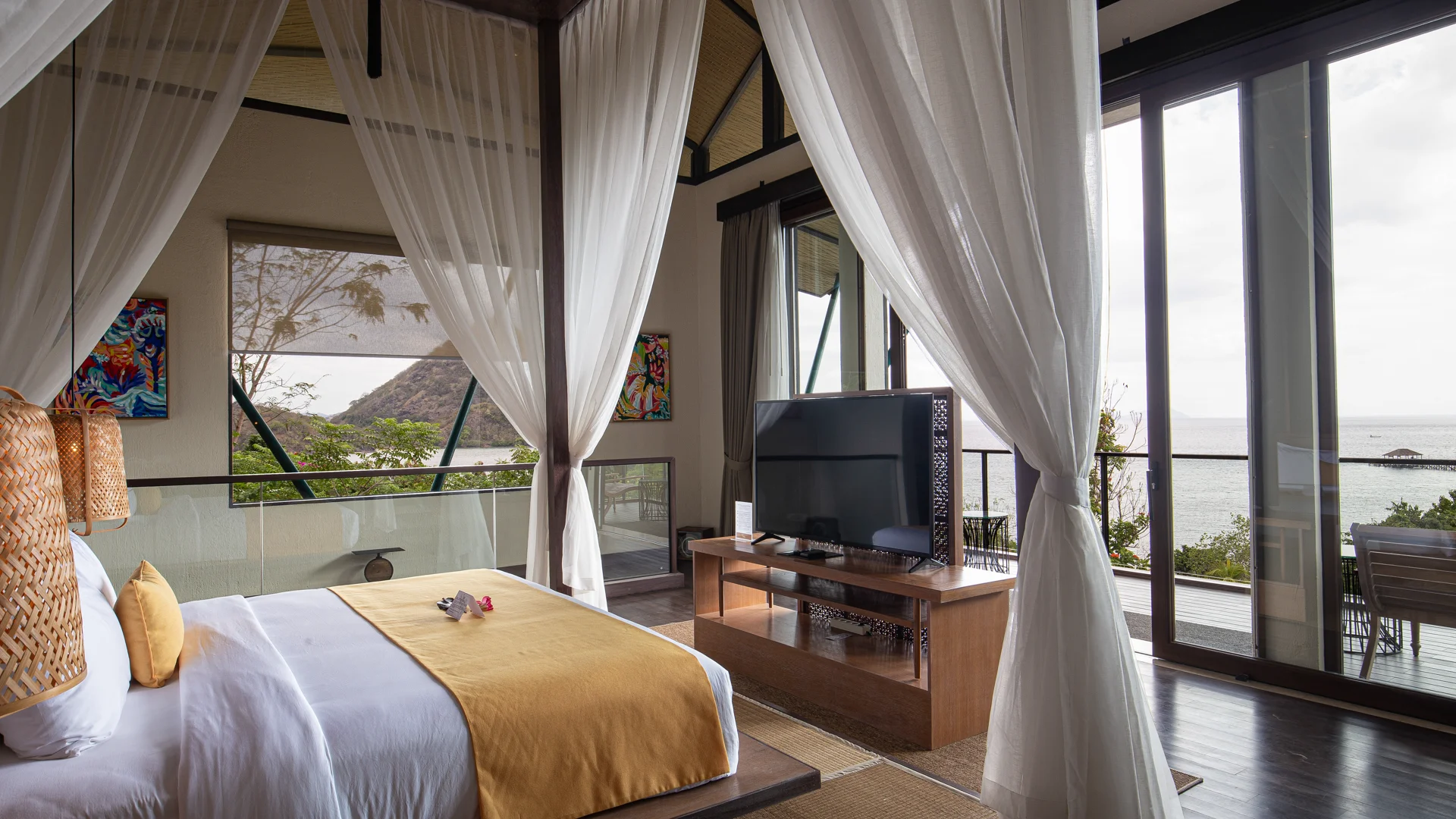 Plataran Komodo villa interior with ocean view through wooden frame